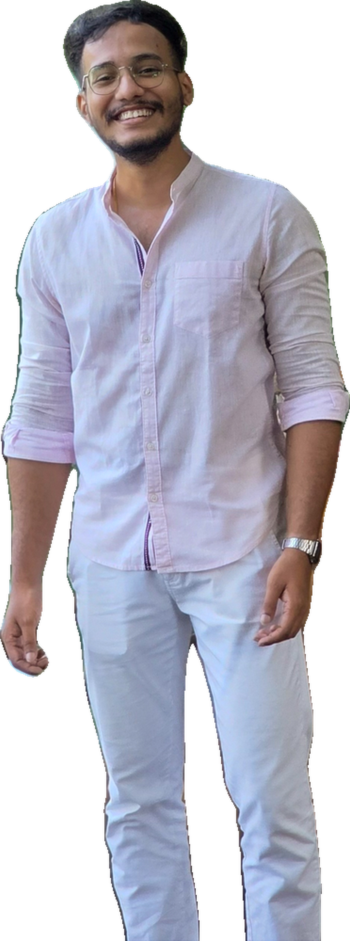 Milind Gauns standing by a lakeside railing in Goa